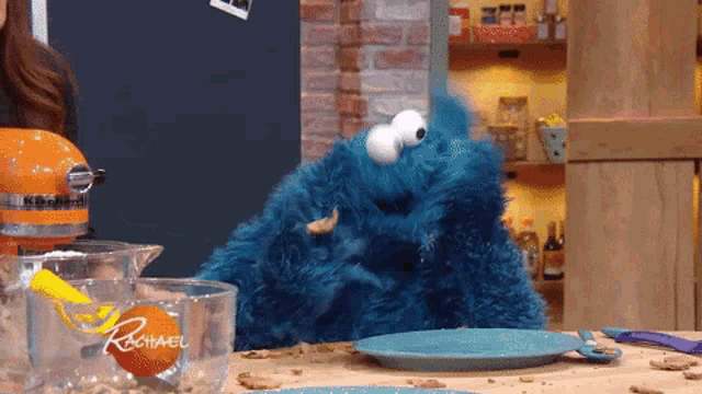 animated gif of the cookie monster eating cookies